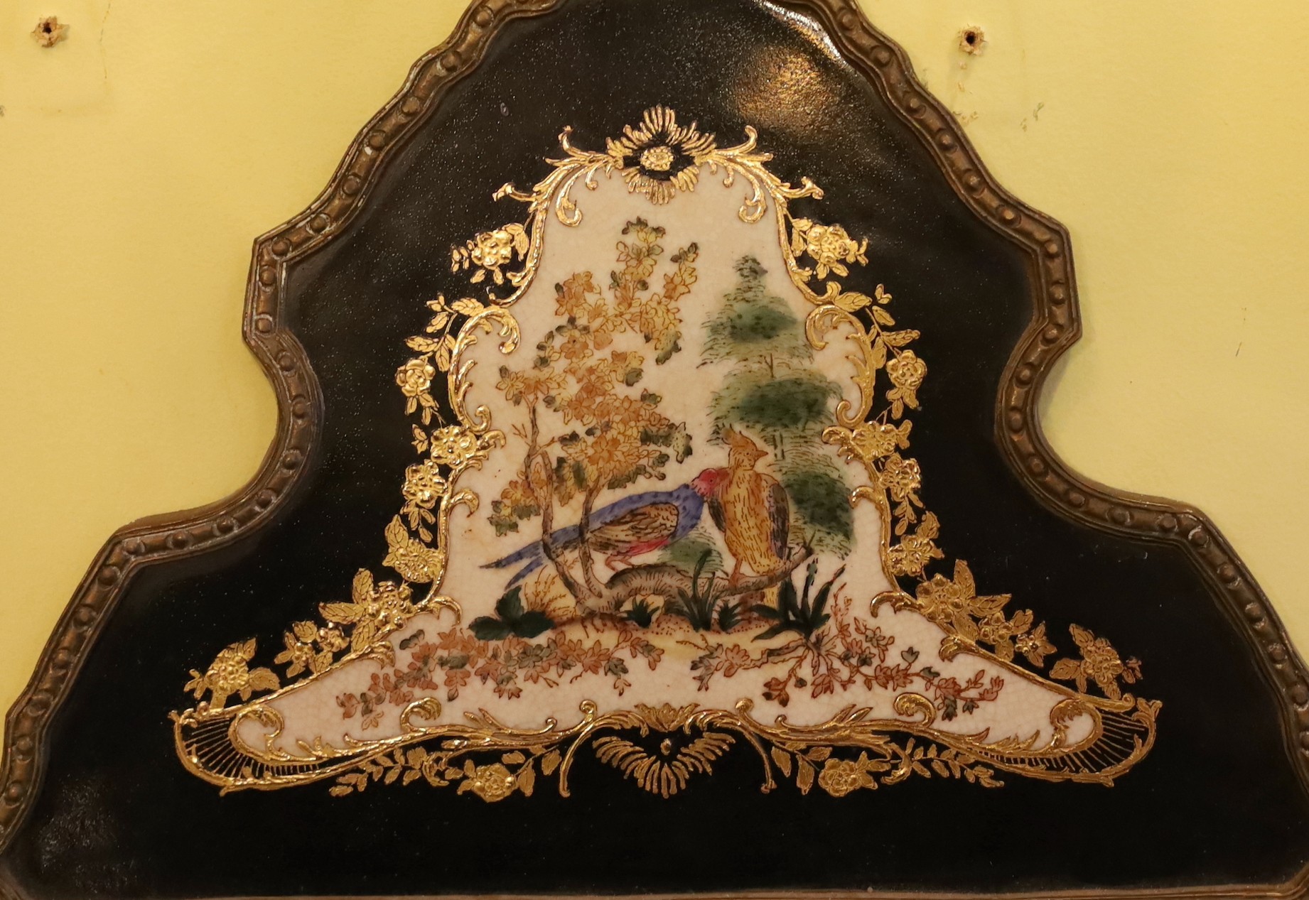 A pair of brass mounted ceramic girandoles in the Louis XIV style, height 64cm. width 38cm